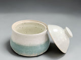 Small handmade pottery sugar container with glossy finish