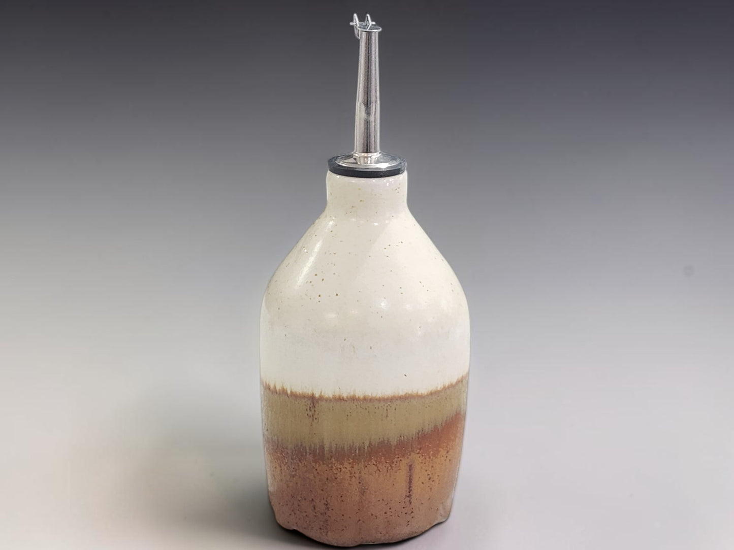 Handmade pottery oil dispenser bottle 400ml in cream and brown glaze, made in Melbourne studio
