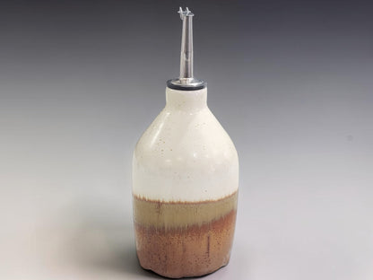 Handmade pottery oil dispenser bottle 400ml in cream and brown glaze, made in Melbourne studio