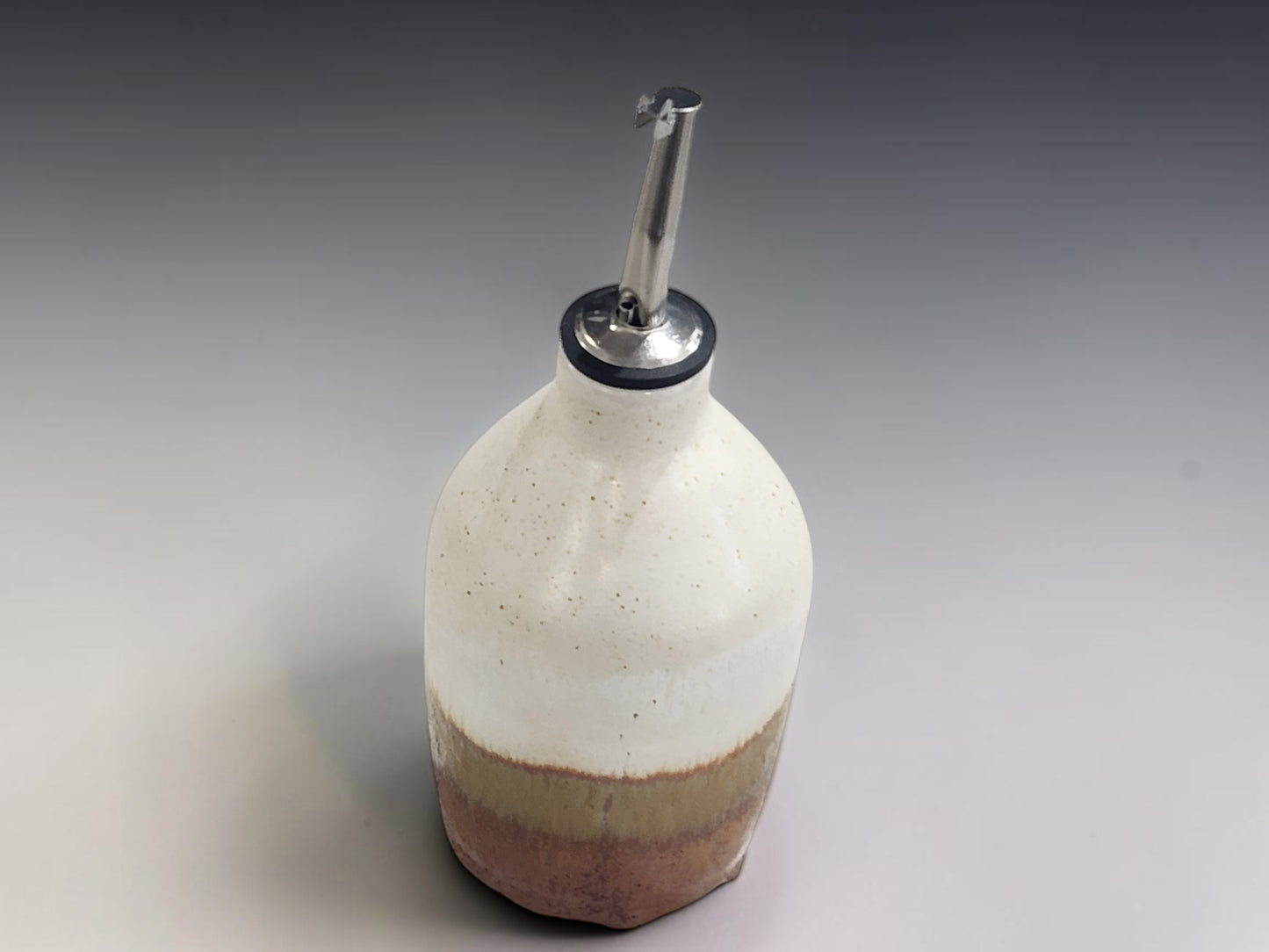 Handmade ceramic cruet bottle for olive oil in soft neutral glaze, Melbourne handmade pottery