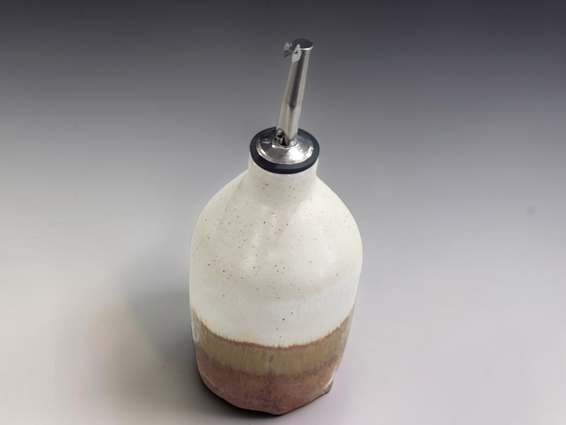 Handmade ceramic cruet bottle for olive oil in soft neutral glaze, Melbourne handmade pottery