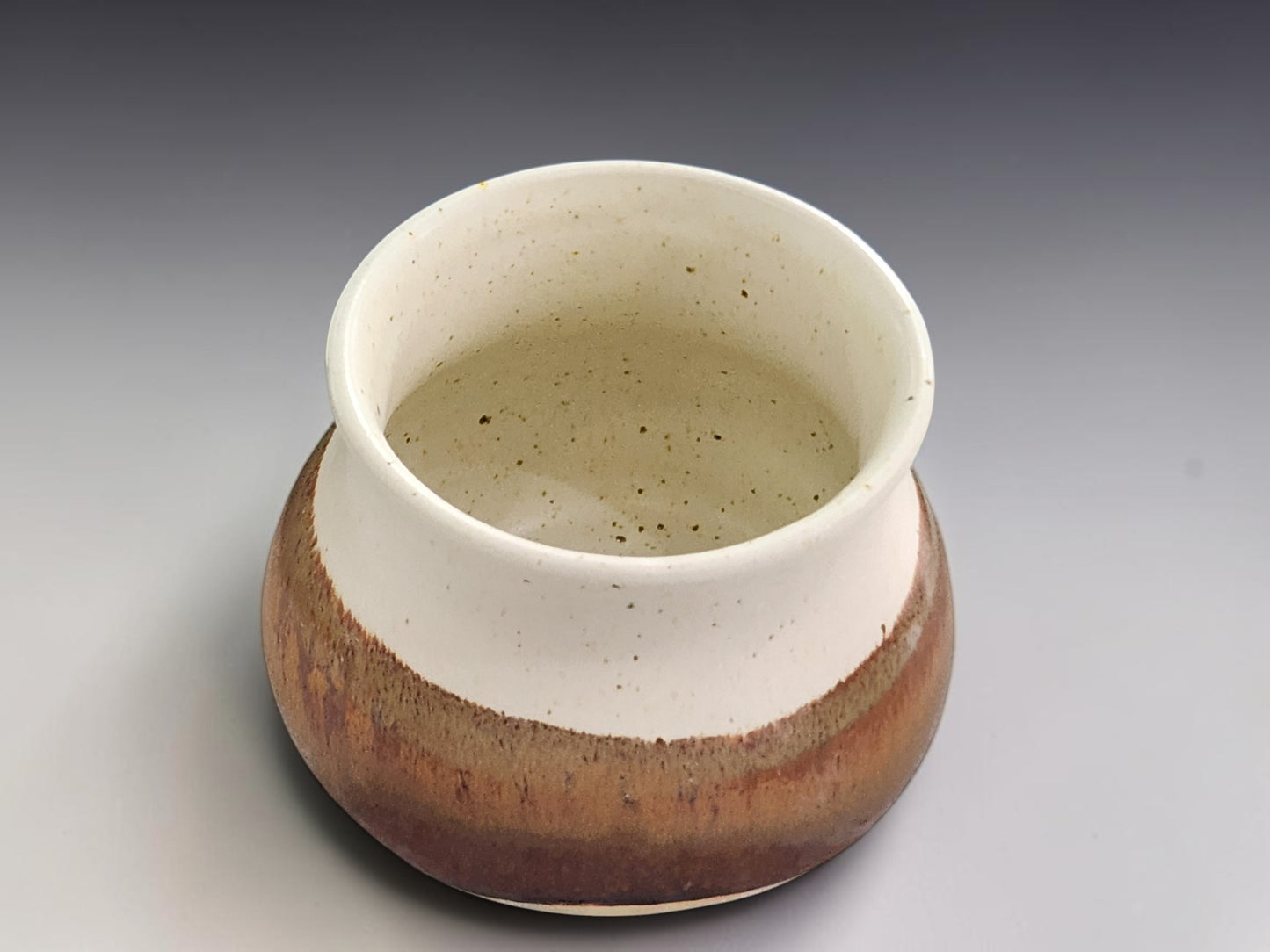 Small handmade ceramic salt pig in cream and earthy terracotta glaze for kitchen bench styling