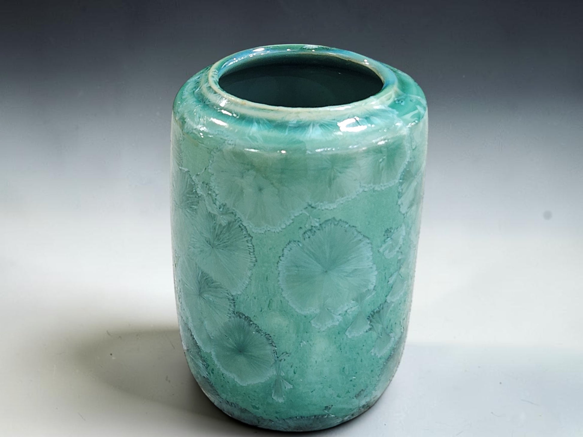 Green crystalline vase with glossy green interior glaze