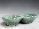 Handmade pottery double snack bowl with mottled green glaze, crafted in Melbourne for serving olives, nuts, dips and shared appetisers.