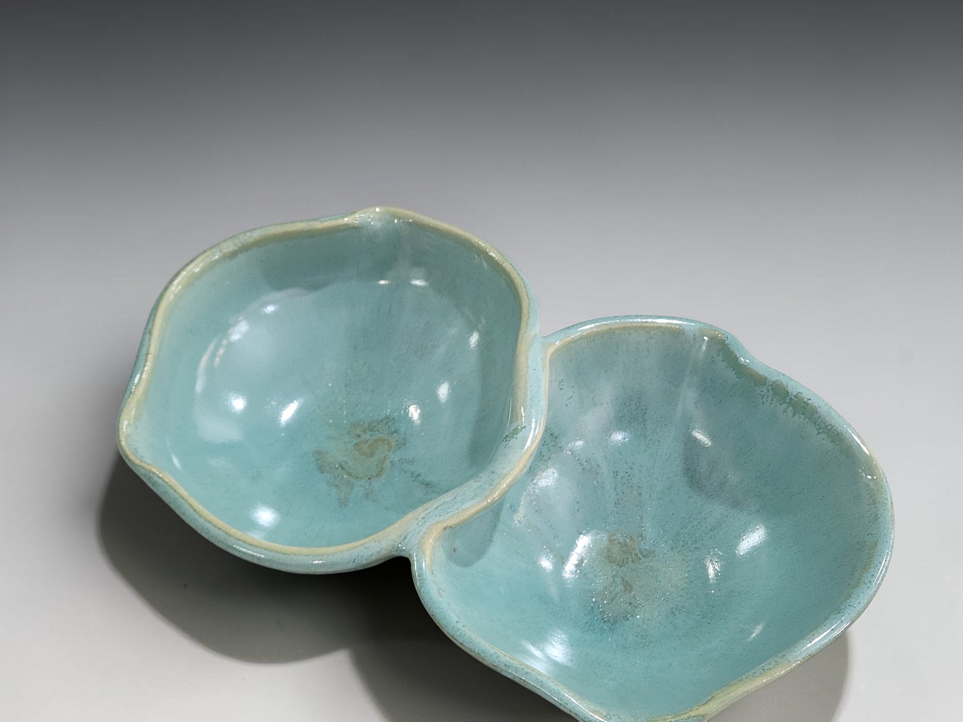 Handmade ceramic double snack bowl in soft aqua glaze