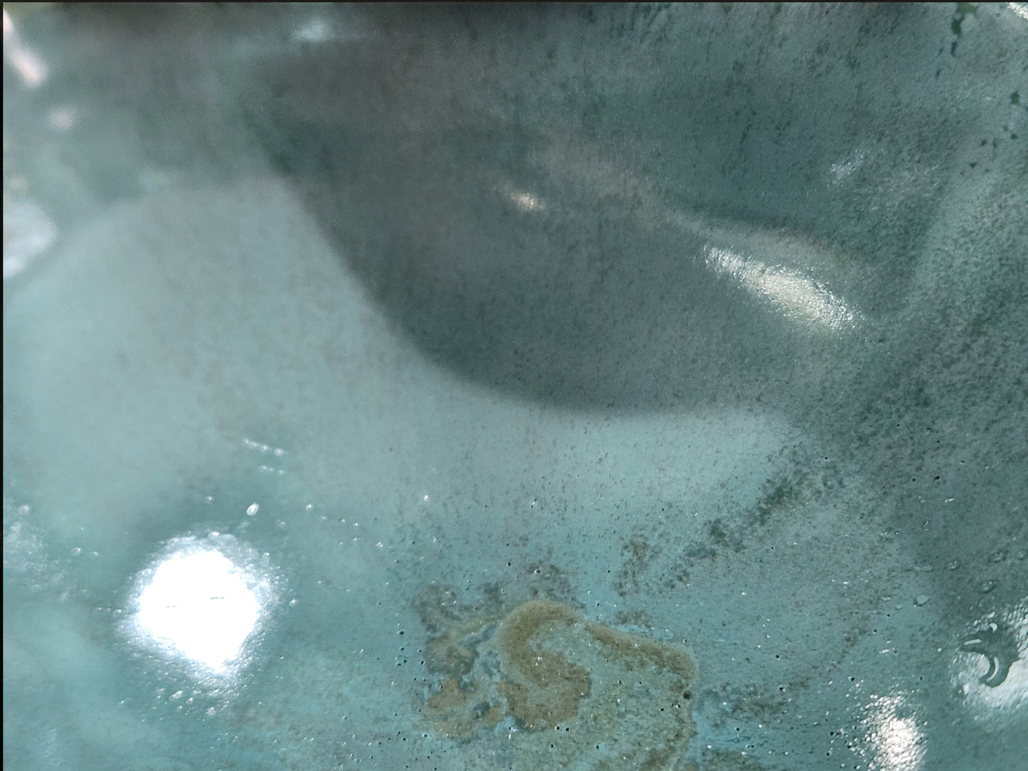 Close-up of soft aqua glaze on a handmade ceramic double snack bowl