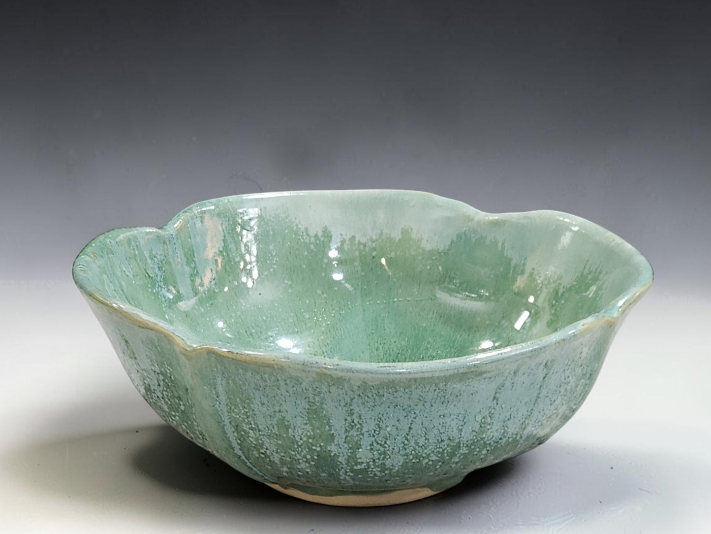 Australian handmade pottery serving bowl in glossy green glaze