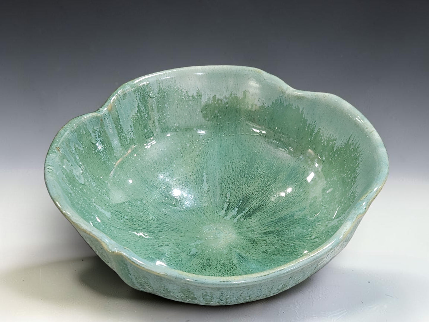 Spearmint green salad bowl with flowing glaze markings