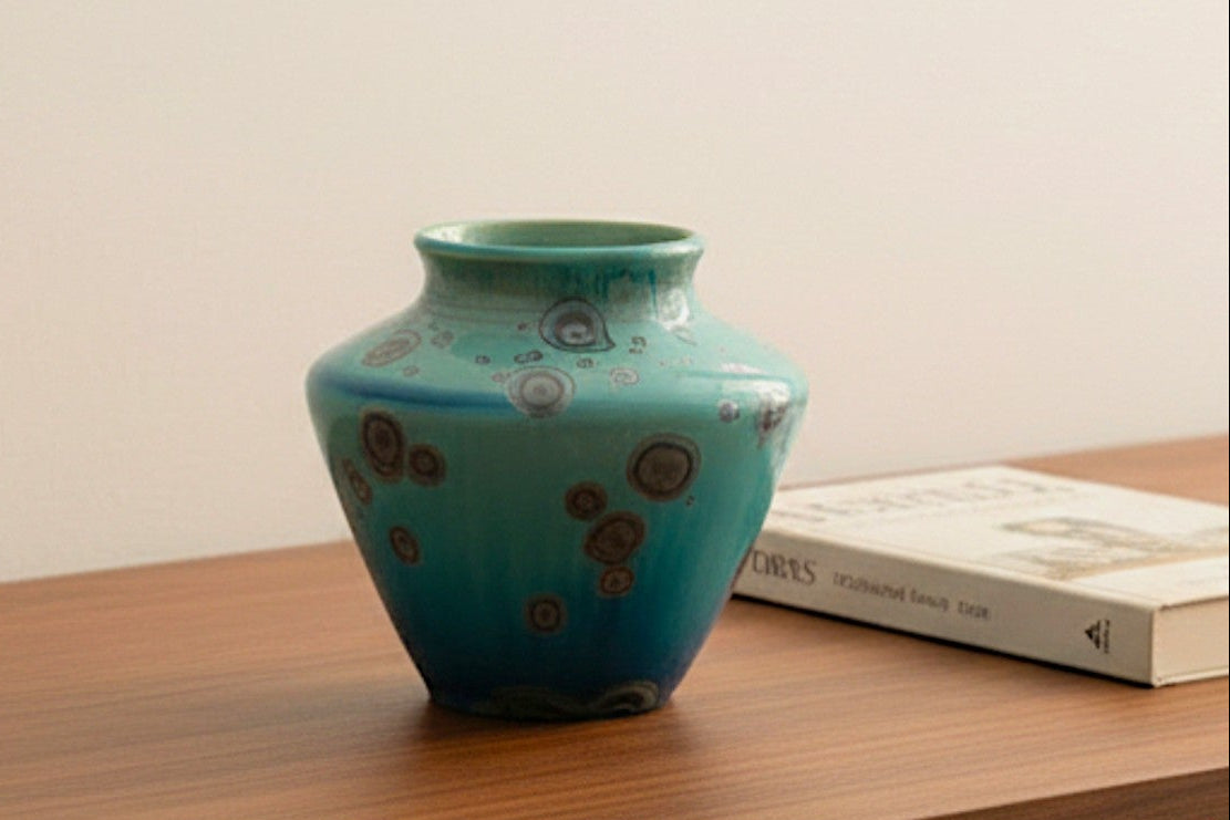 Handmade mini bud vase in blue-green galaxy glaze with metallic crystals, front view