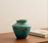 Handmade mini bud vase in blue-green galaxy glaze with metallic crystals, front view