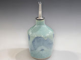 Unique pottery oil bottle in green and blue tones