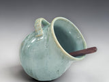Handmade green ceramic salt pig with wooden spoon