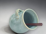 Small pottery salt pig in soft sage green glaze