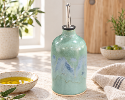 Handmade oil bottle styled with olives in a bright kitchen
