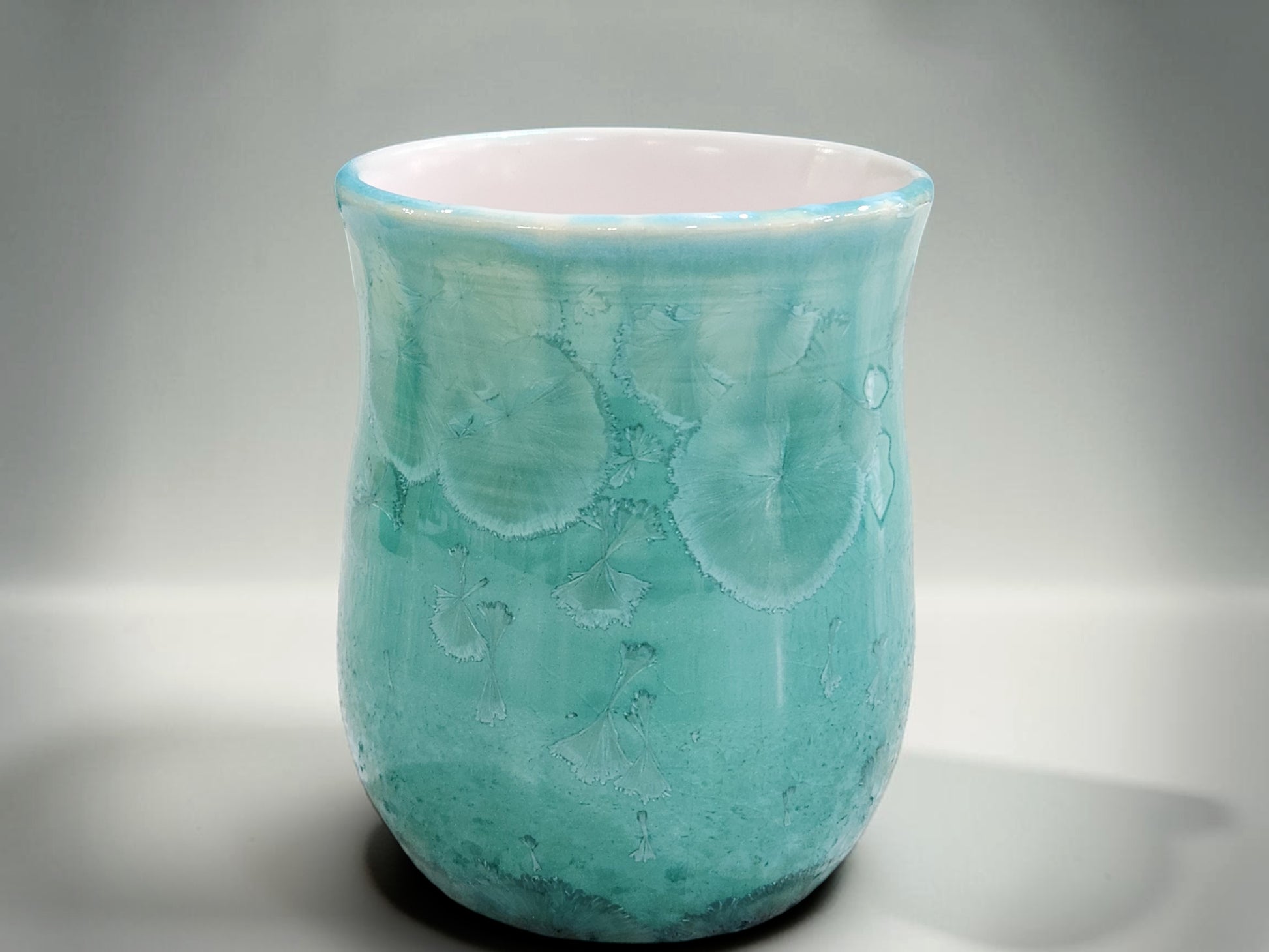 Handmade Australian porcelain mug with glossy green crystal glaze