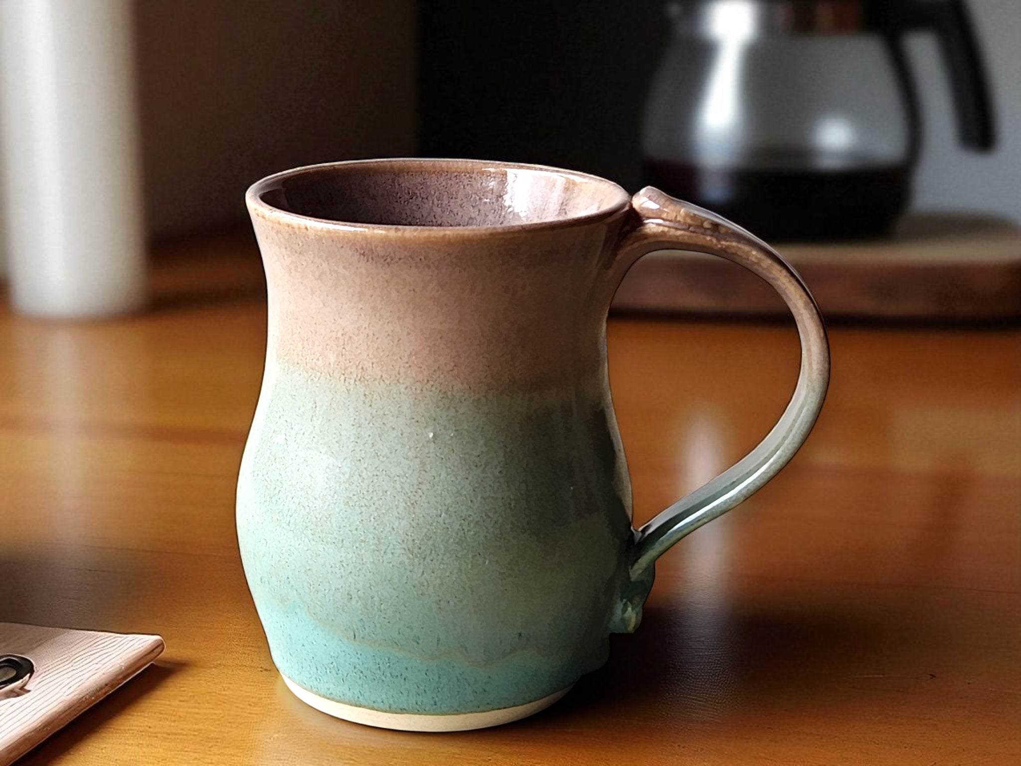 Large handmade pottery mug with oatmeal brown and spearmint green glaze