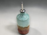 Handmade oil bottle with glossy glaze and stainless steel pourer