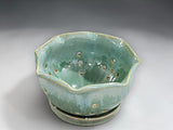 Handmade green ceramic berry bowl with matching saucer