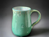Unique green ceramic coffee mug with crystalline glaze detail