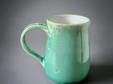 Elegant handmade green mug for coffee or tea lovers