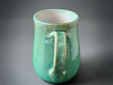 One-of-a-kind green pottery mug with artisan crystal glazing