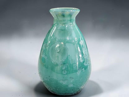 Green crystalline vase with glossy green lining glaze
