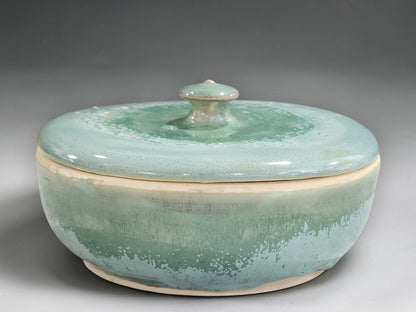 Handmade stoneware lidded bowl in soft green glaze
