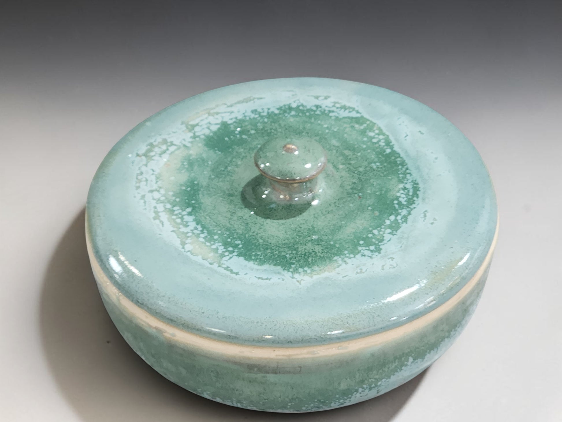 Green pottery serving bowl with handmade lid