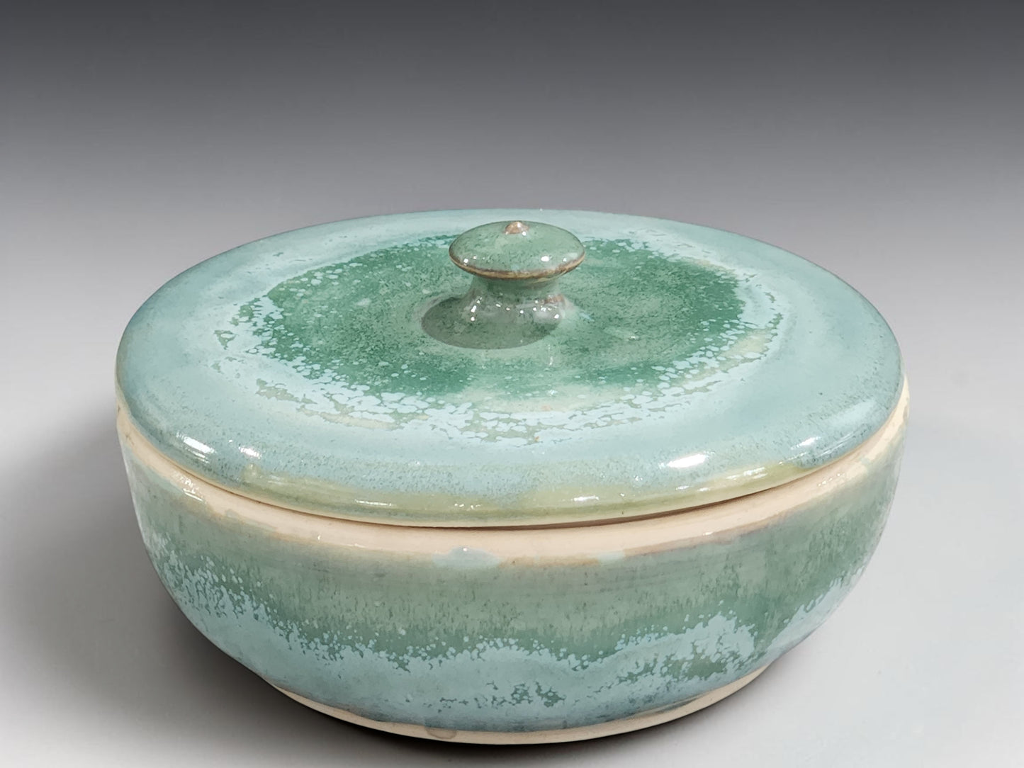 Handmade pottery storage bowl with lid