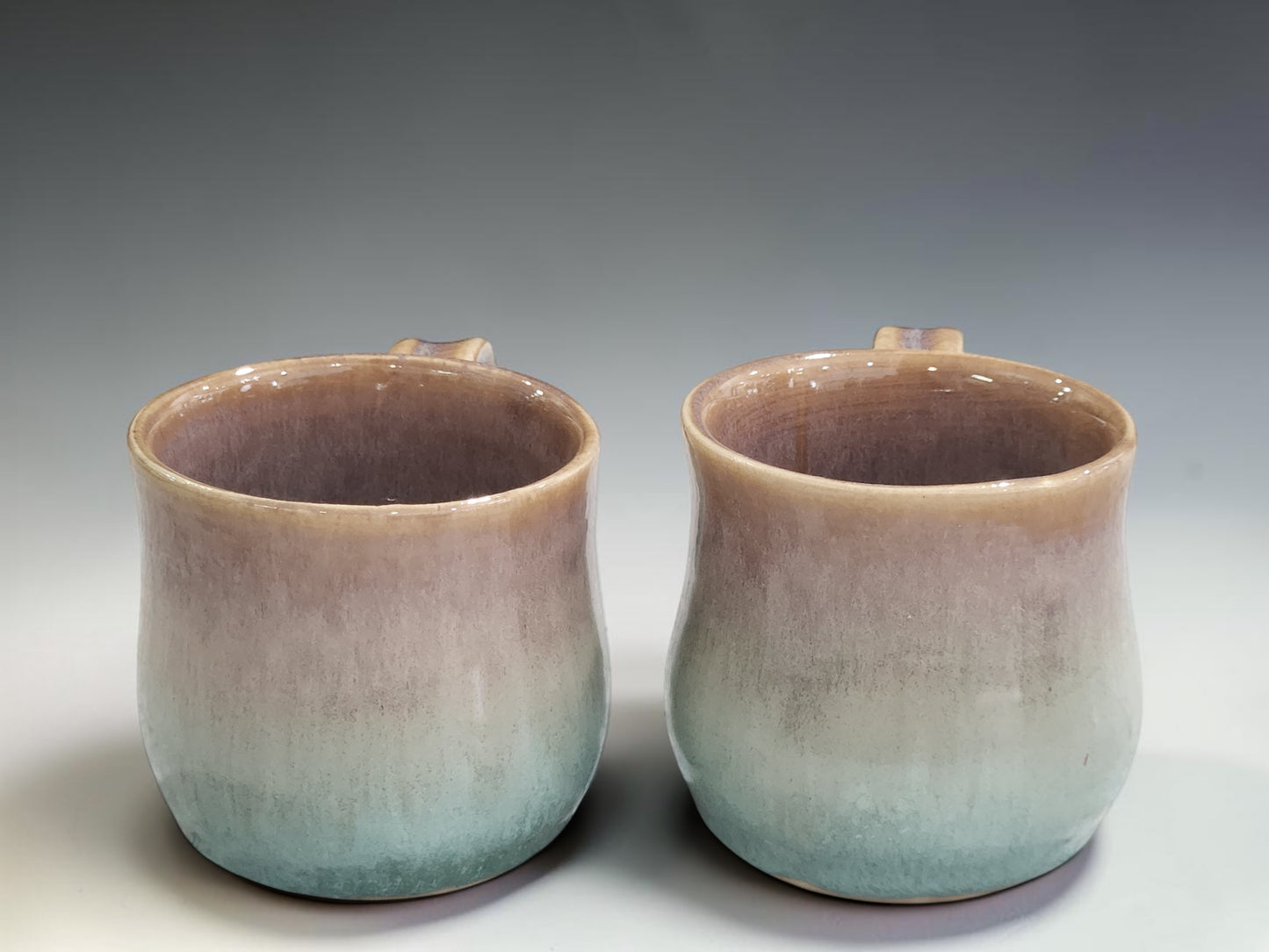 Wheel thrown ceramic mug with comfortable handle and organic mottled glaze finish by Buxton Pottery.