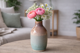 Handmade ceramic bud vase with flowers on coffee table in lounge room, handmade pottery Melbourne Australia unique gift