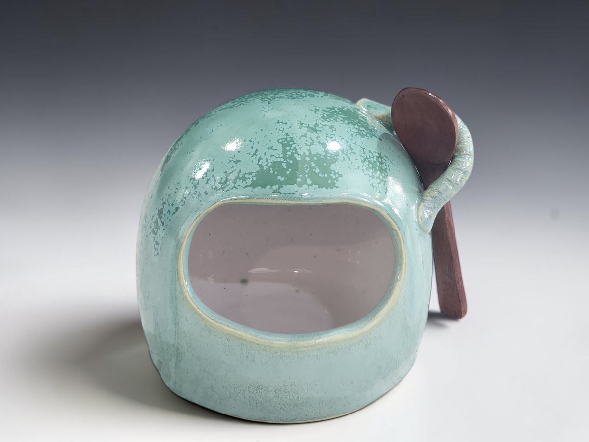 Front view of handmade green stoneware salt pig with wide opening
