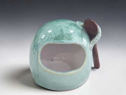 Front view of handmade green stoneware salt pig with wide opening