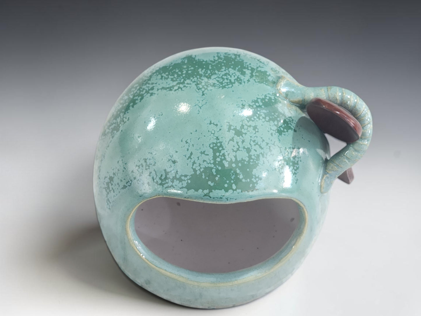 Australian pottery salt pig measuring 11 cm tall with wooden spoon