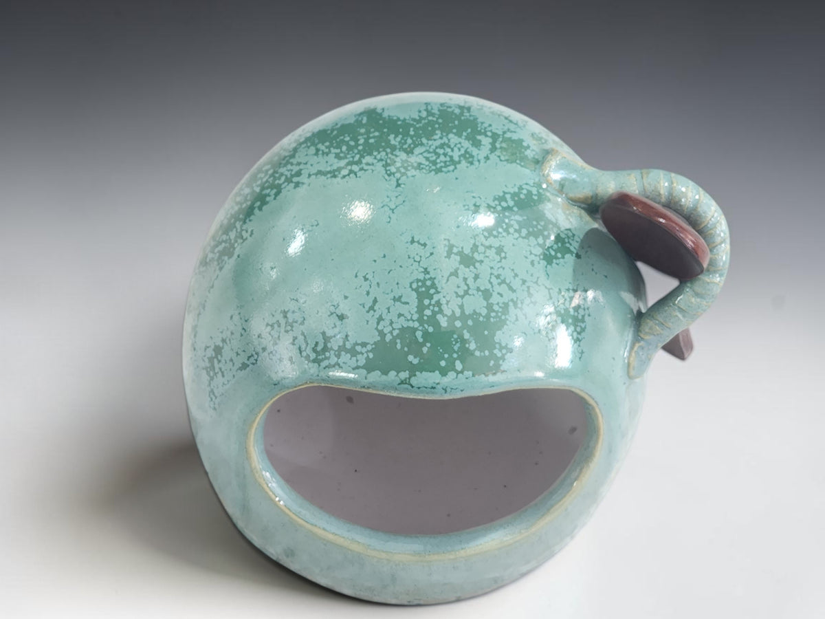 Australian pottery salt pig measuring 11 cm tall with wooden spoon