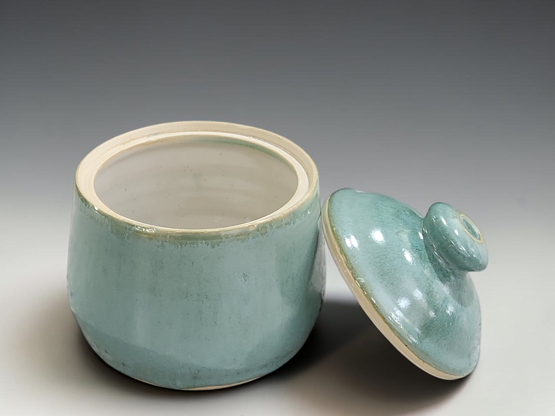 Handmade pottery lidded jar in seafoam green glaze for sugar, tea or small pantry storage