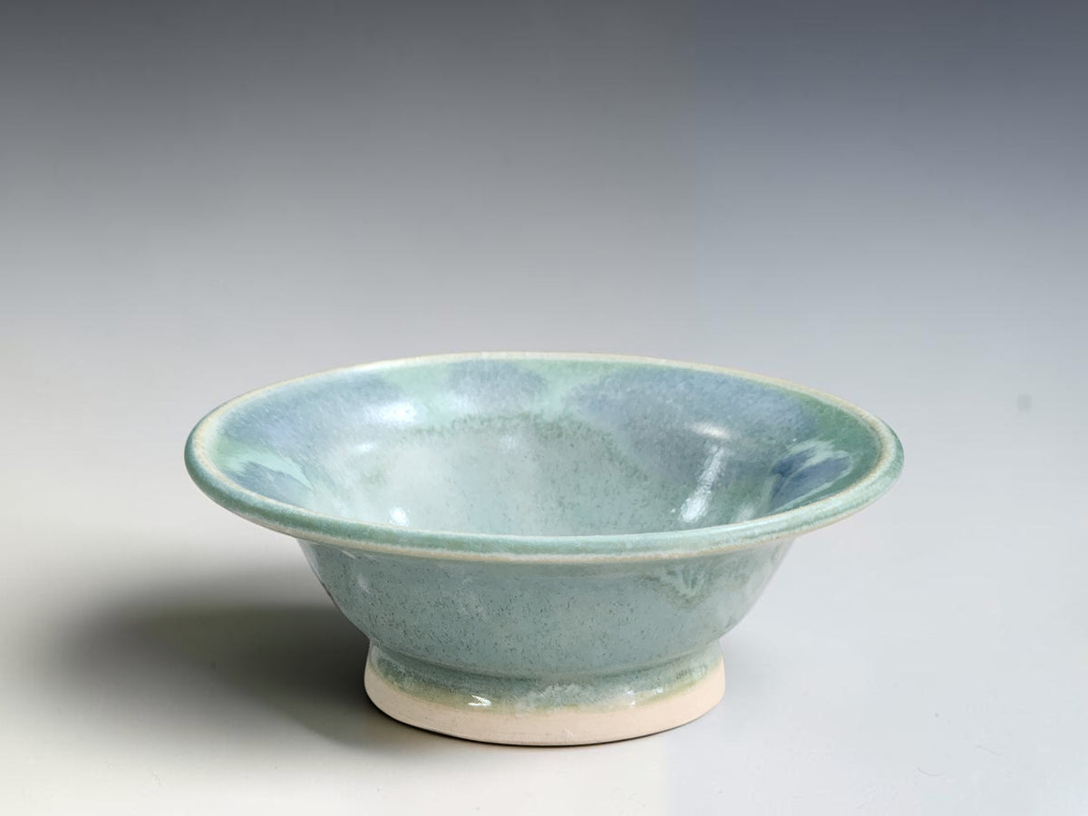 Handmade ceramic trinket bowl with soft seafoam green and blue glaze by Buxton Pottery.