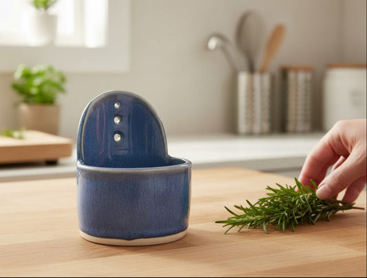 Blue handmade pottery herb stripper on timber kitchen bench