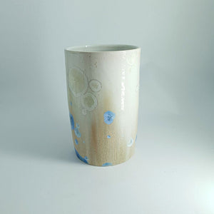 Ombre cream-to-tan ceramic vase with floating crystals