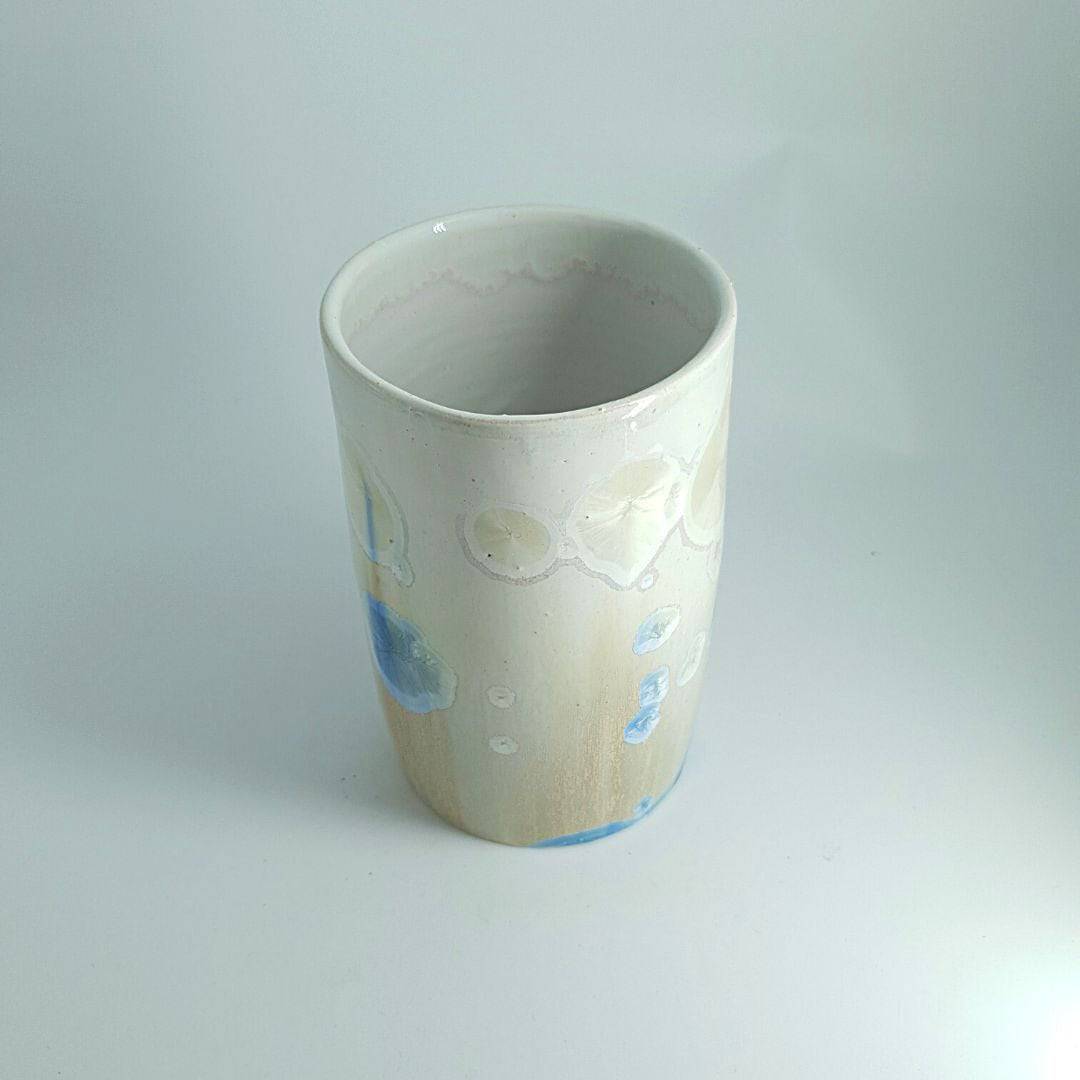 Top view of Blue crystal detail on tall handmade pottery vessel