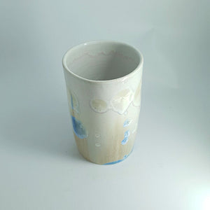 Top view of Blue crystal detail on tall handmade pottery vessel