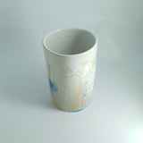 Top view of Blue crystal detail on tall handmade pottery vessel