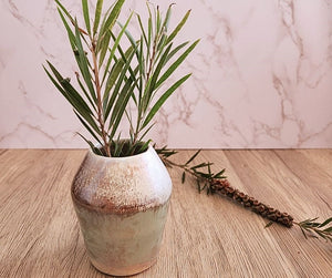 Green brown and white pottery bud vase with mother of pearl finish