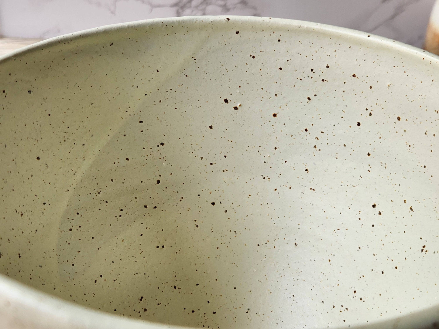 Handmade ceramic bowl with glossy  speckled cream interior
