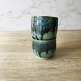 Wheel-thrown handmade pottery cup with spearmint and layered glaze