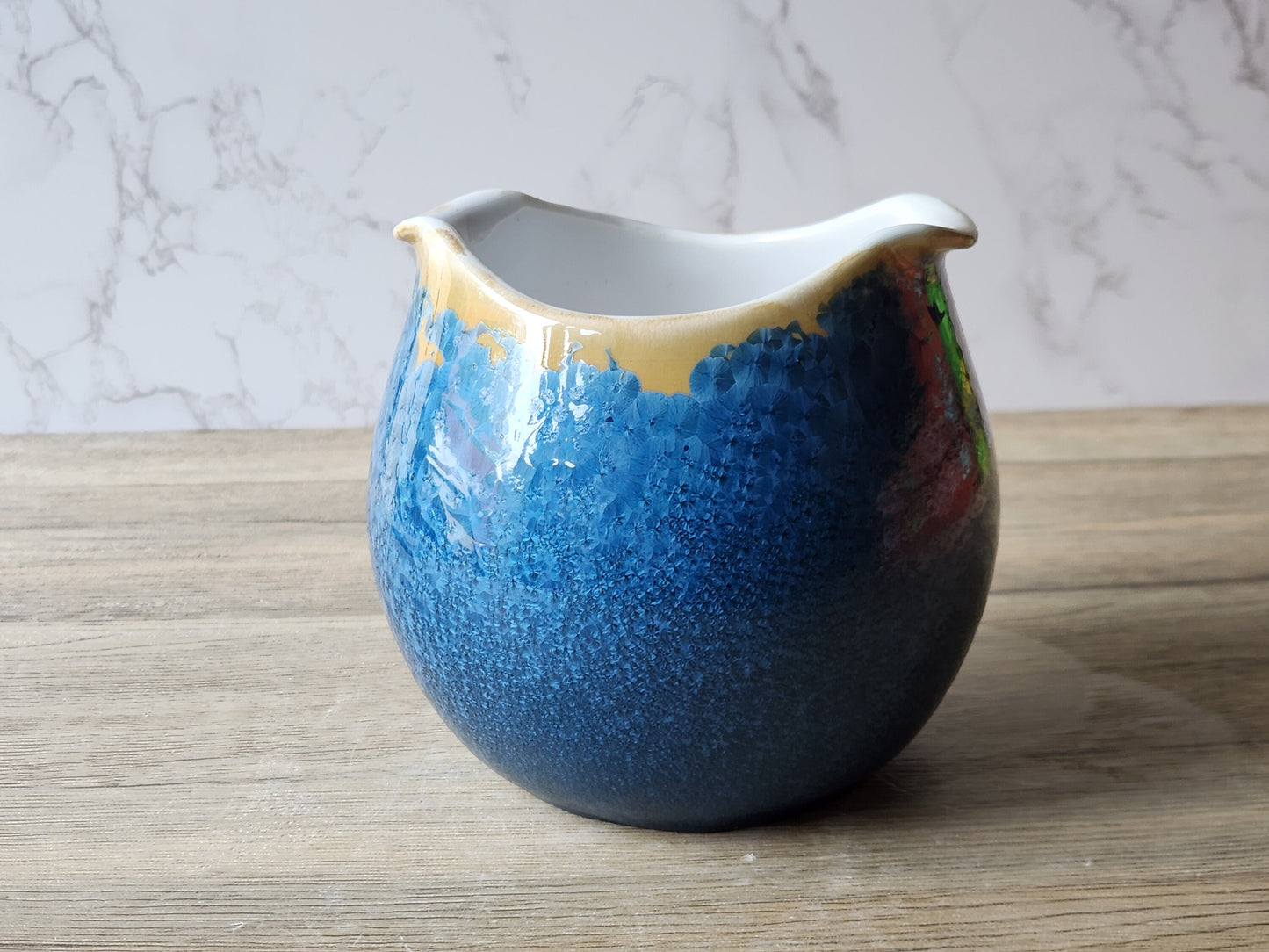 Hand-made Artisan pottery bowl with blue crystalline exterior and white interior