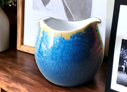 Handmade porcelain bowl with blue and orange crystalline glaze