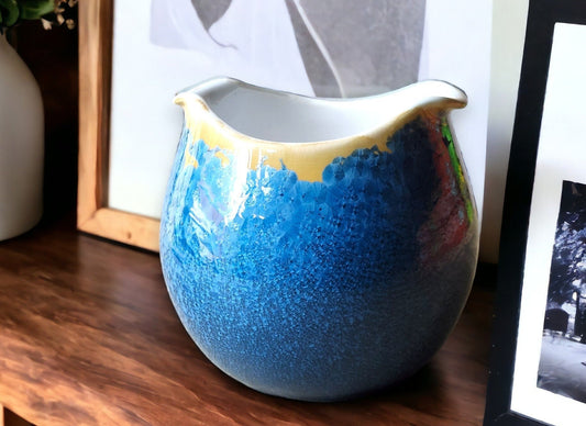 Handmade porcelain bowl with blue and orange crystalline glaze