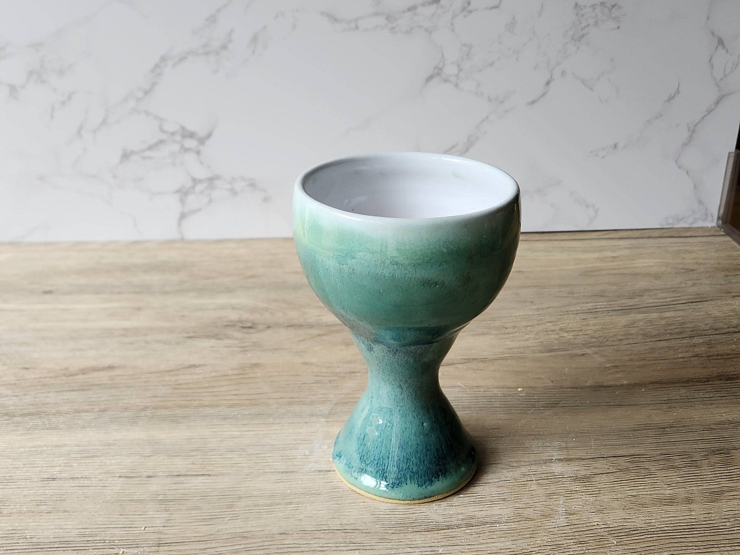 Side view of handmade goblet with flared base