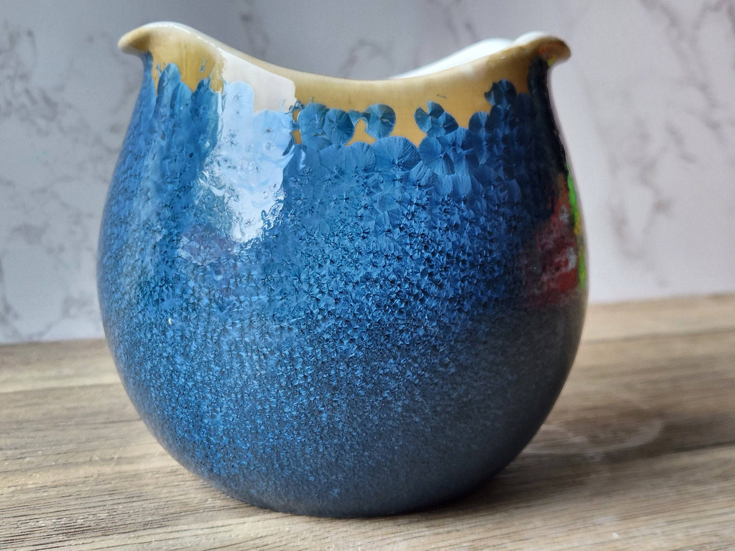 High-fired handmade porcelain bowl showcasing unique crystalline patterns